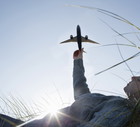 Teenage girl holding model aeroplane