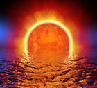Sunset Light Fire Glow on Water Reflection at Night. Sunrise at Sea Ocean