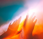 Human hands stretched out to the burning sun, ethereal and unreal concepts of Universe, spiritual and natural powers