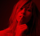 Young woman with finger on mouth