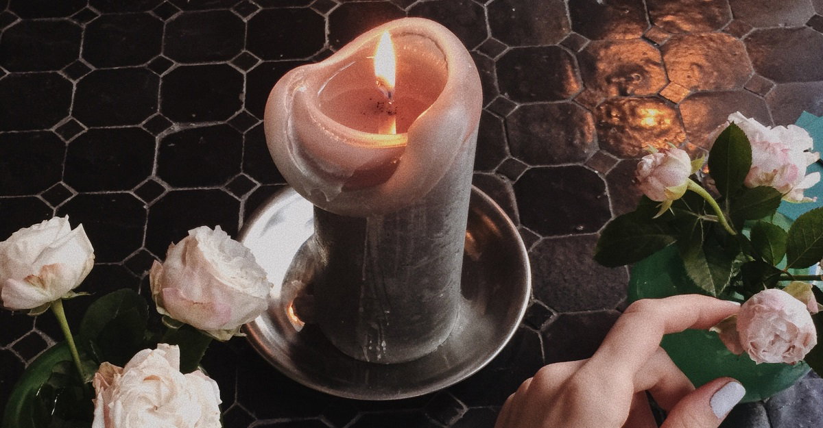 Cropped Image Of Woman Touching Flower