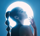Magical, beautiful and face of a girl with lighting isolated on a dark background in a studio. Idea, creative and woman thinking of futuristic glow from light, art and cosmetics on a backdrop
