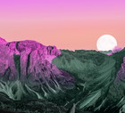 Dreamy colorful picture of the Dolomites mountains with vivid colors and full moon.