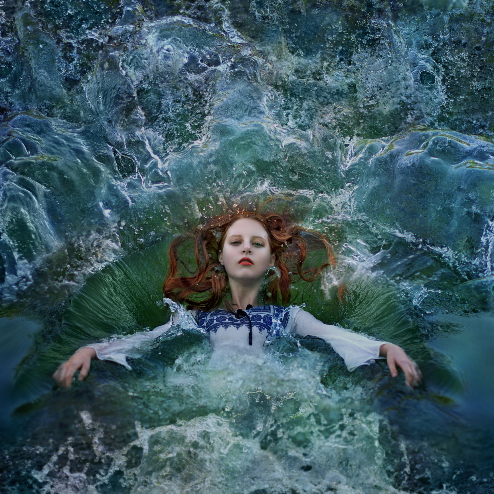 Red haired woman falling into water