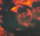 Creative picture of dramatic sunset sky with circle mirror reflection.