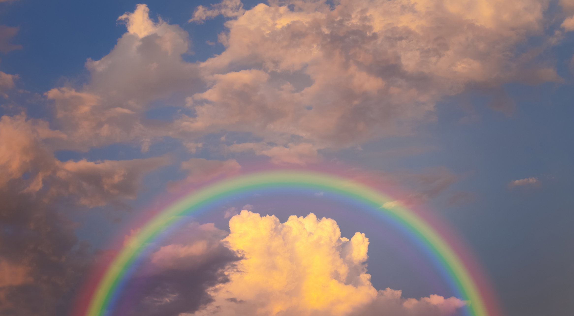 rainbow in cloudy sky
