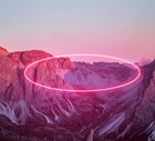Stunning circle made with neon light performing in the Alps mountains.