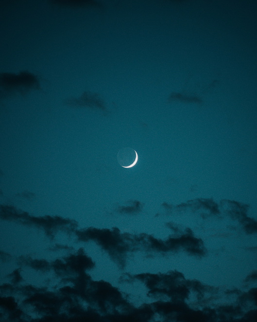 Low Angle View Of Moon In Sky At Night