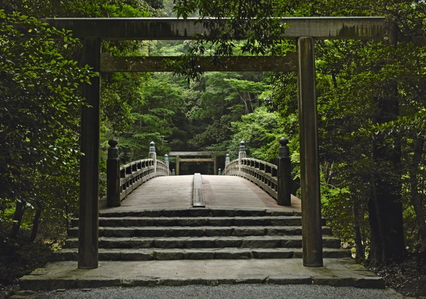 A Torii stands before a bridge in the Jingu shrine in Ise, Japan.