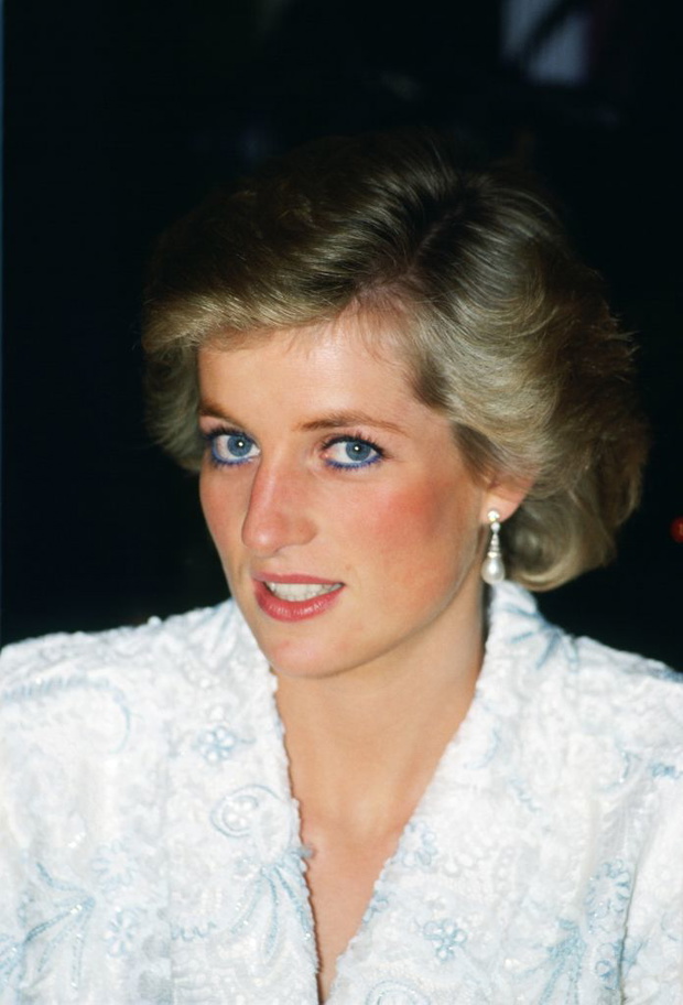 Diana, Princess of Wales wears a white and blue lace and seq
