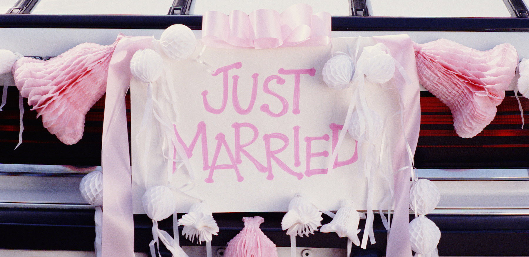 BACK OF CAR WITH JUST MARRIED SIGN