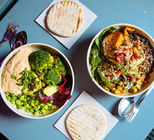 Vegan bowls with various vegetables and seeds, high angle view