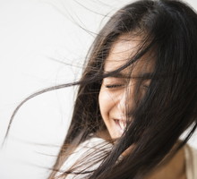 Hair of Indian woman blowing in wind