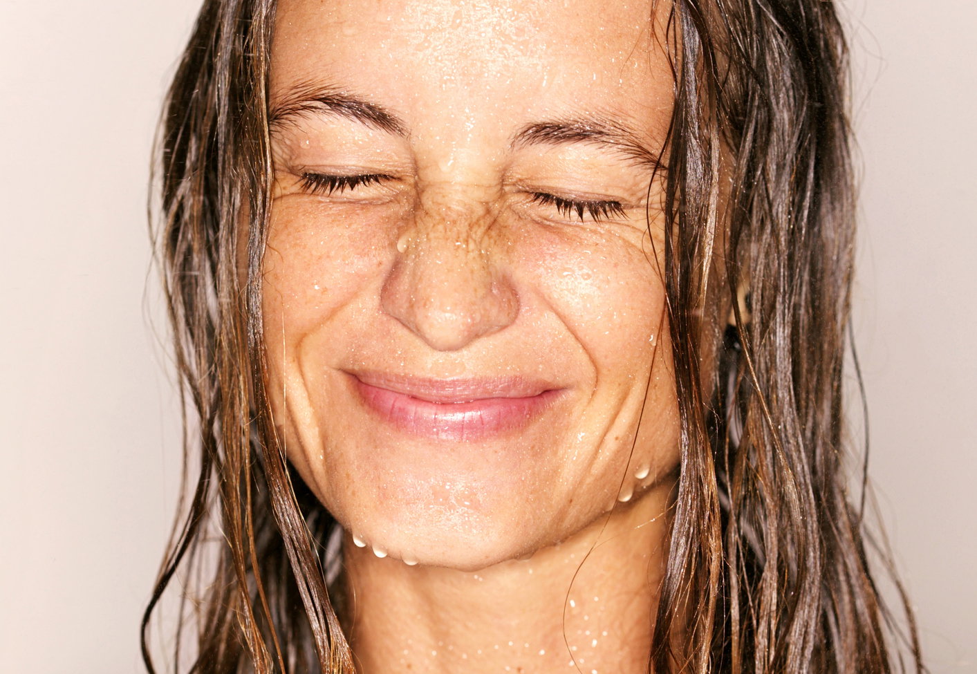Head and shoulders shot of wet woman