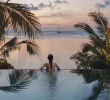 Woman in a pool on the beach