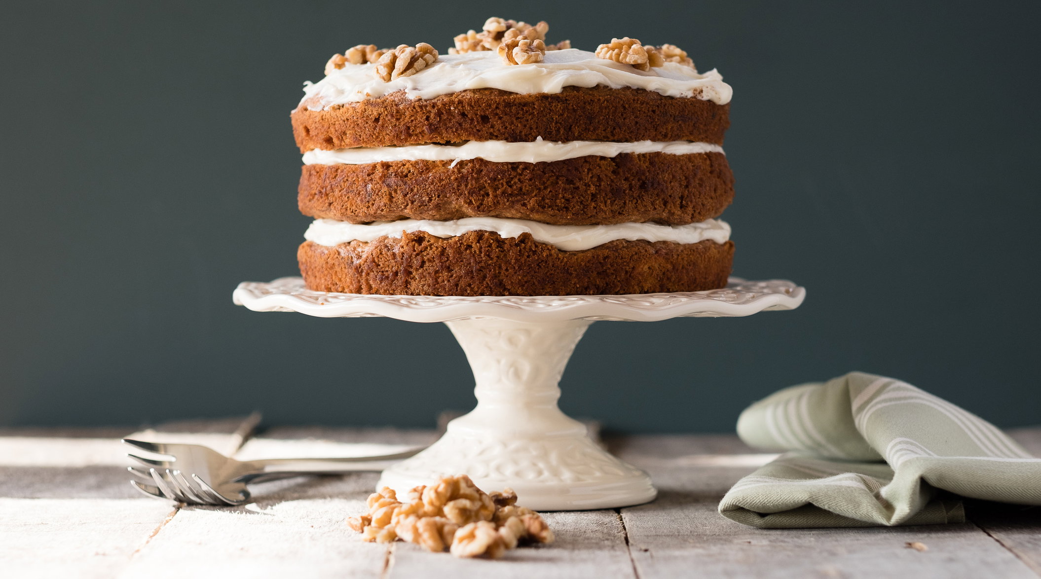 Carrot Cake On A Cake Stand With Cream Cheese Frosting