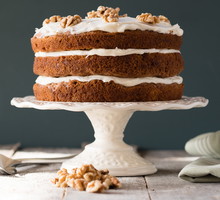 Carrot Cake On A Cake Stand With Cream Cheese Frosting