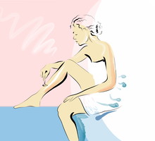 woman shaving her legs