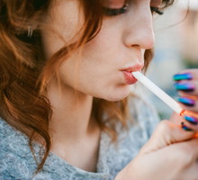 Close-Up Of Beautiful Woman Smoking Cigarette