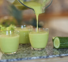 Pouring a freshly made organic smoothie, close up.