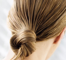 Young woman with wet hair, view from the back, close up (studio)