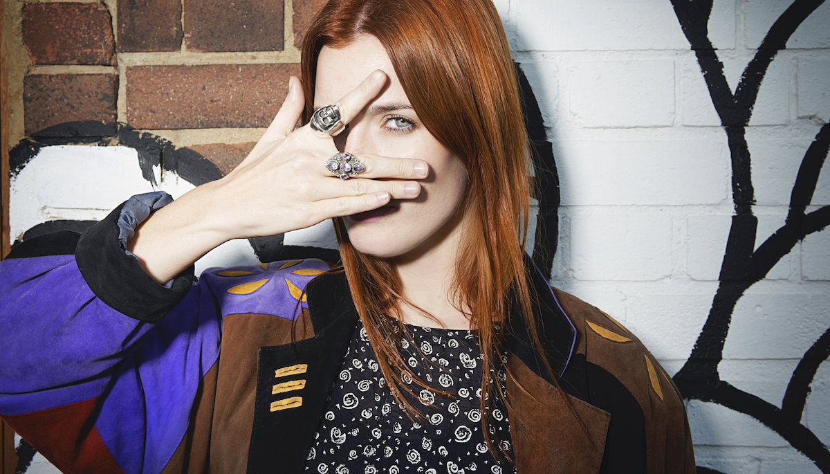 trendy woman posing for camera