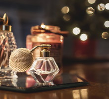 Close-up of perfume sprayers on wooden table