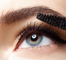 Close-up of make-up eye with long lashes with black mascara