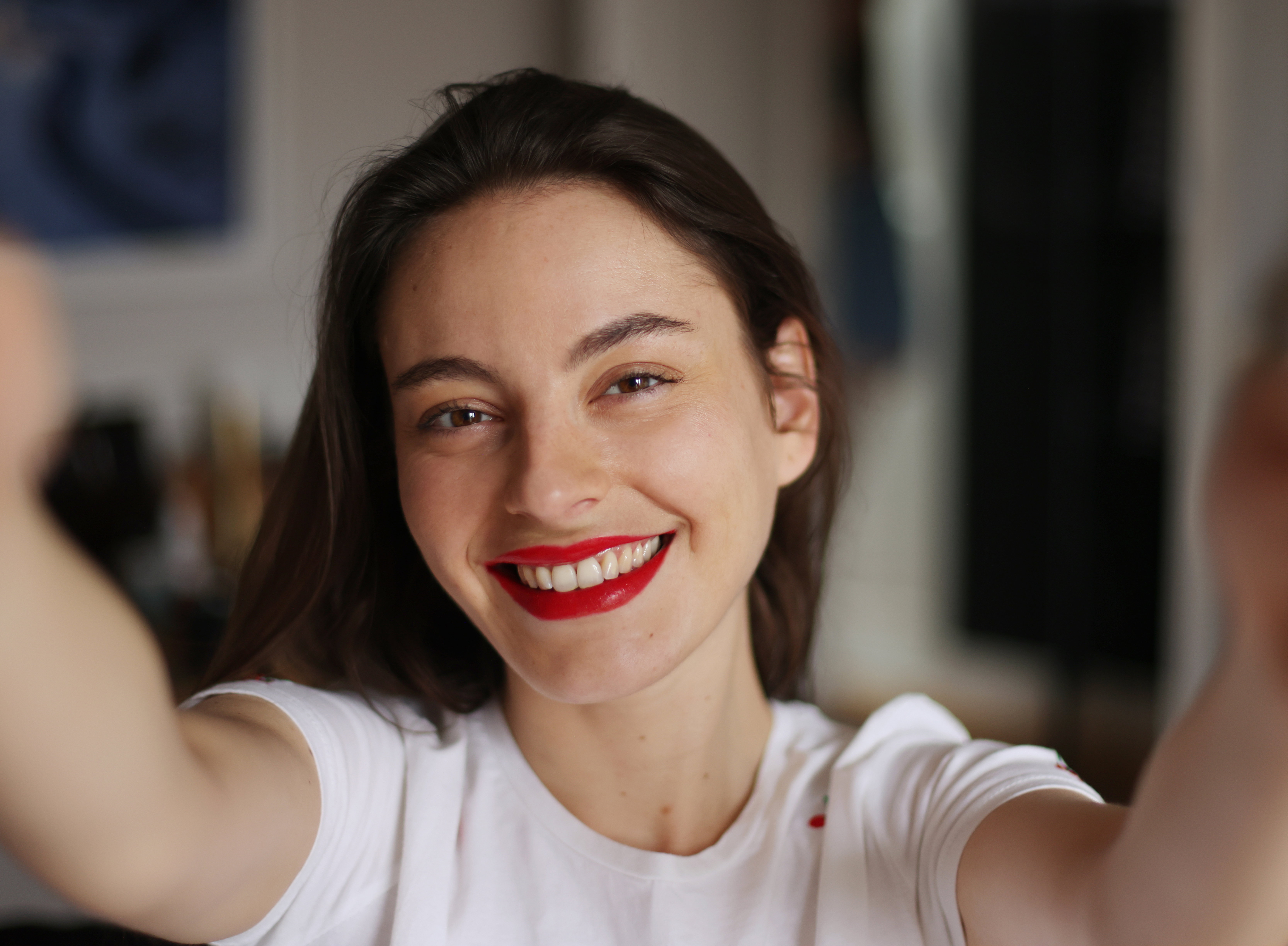 A beautiful brunette woman taking a selfie