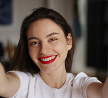 A beautiful brunette woman taking a selfie