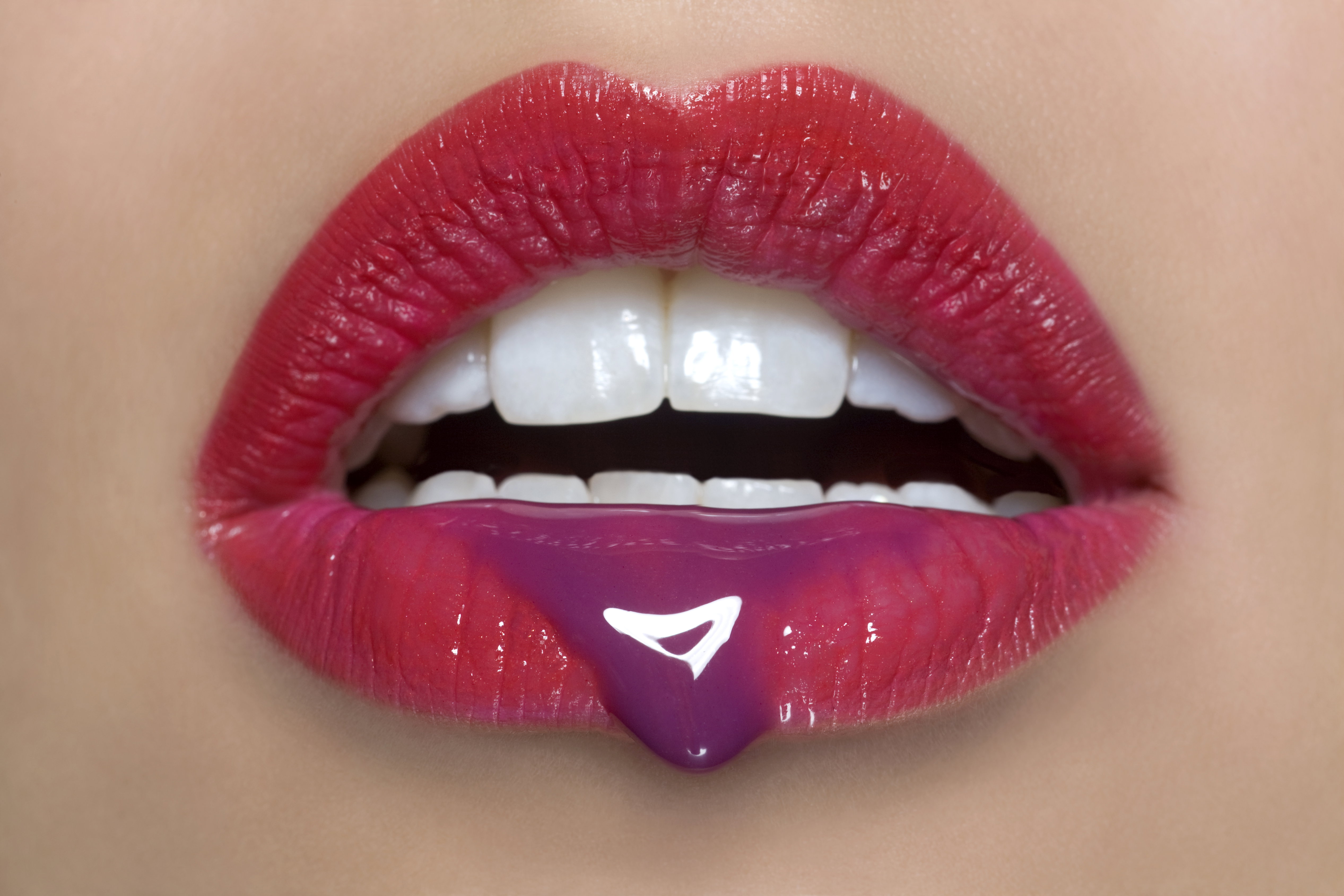 Woman's mouth with red lipstick, close up.