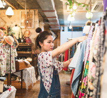 Young woman shopping in a vintage clothing store
