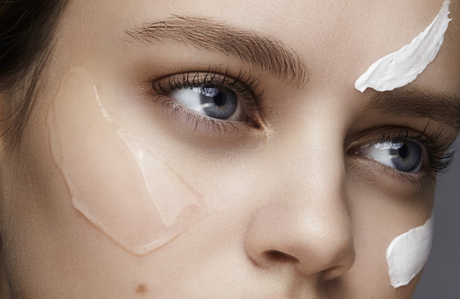 close up of a young woman with cream and gel on her face