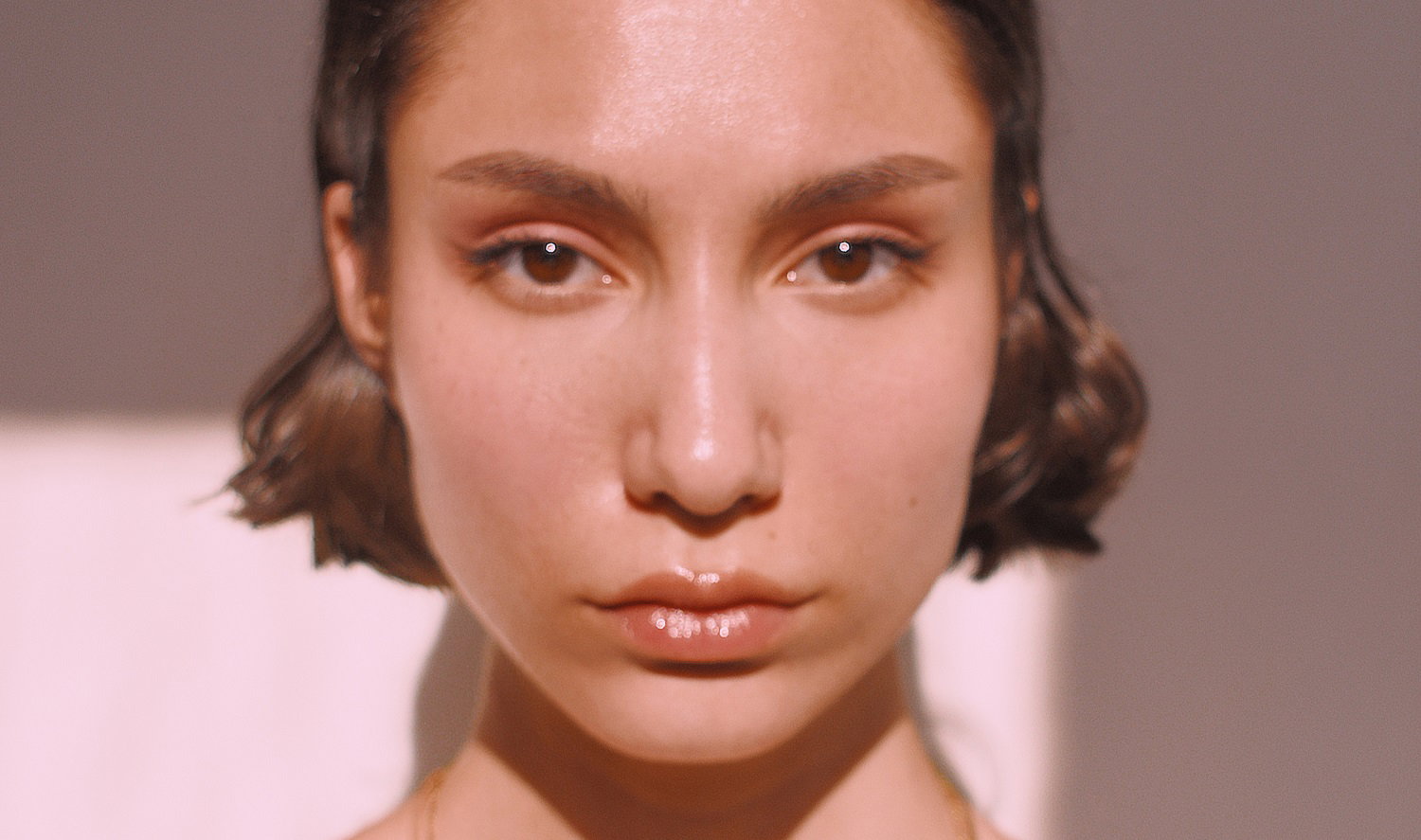 Close-Up Portrait Of A Serious Young Woman