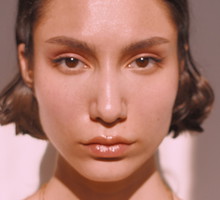 Close-Up Portrait Of A Serious Young Woman