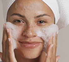 Young woman washing face