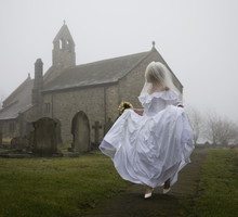 bride running away from a church