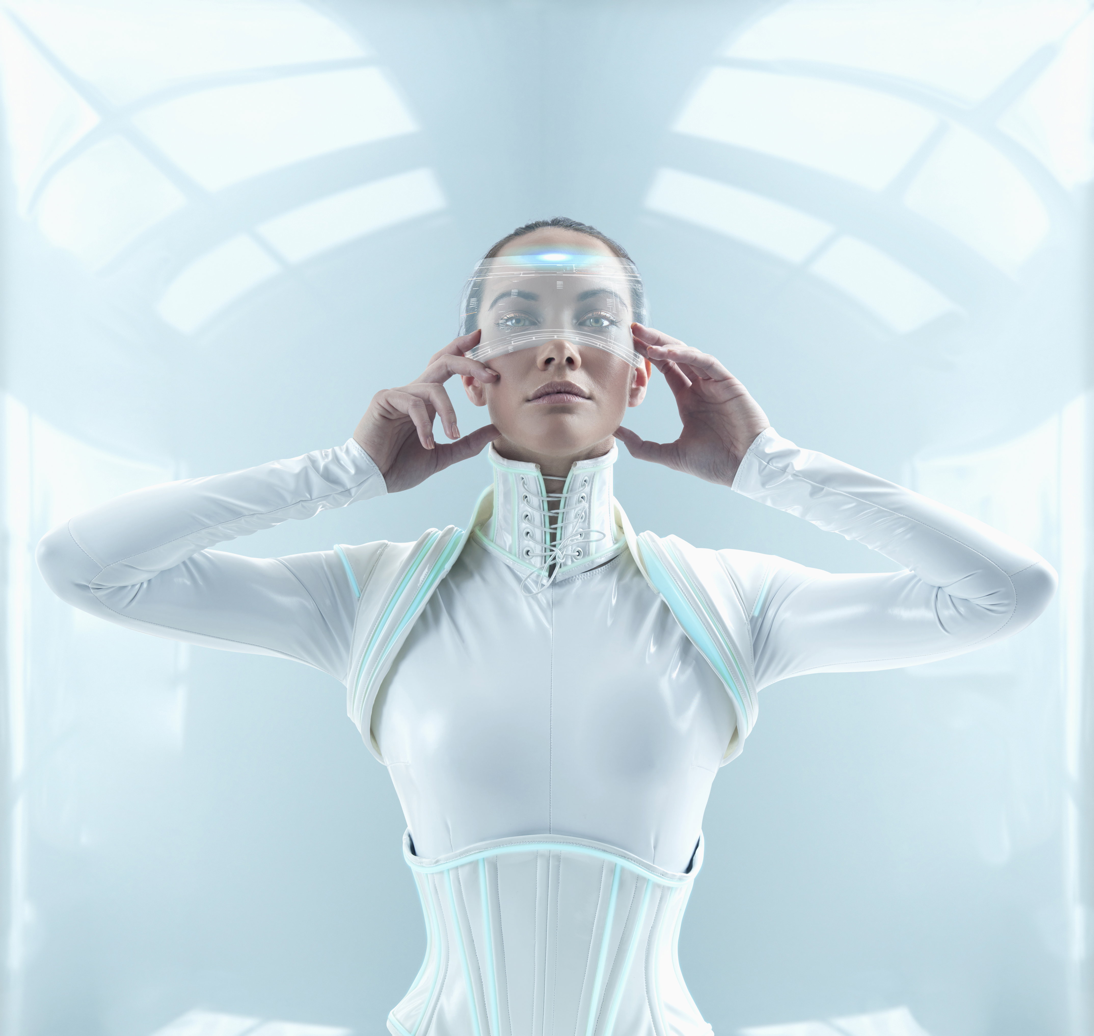 Futuristic Pacific Islander woman holding display screen to face
