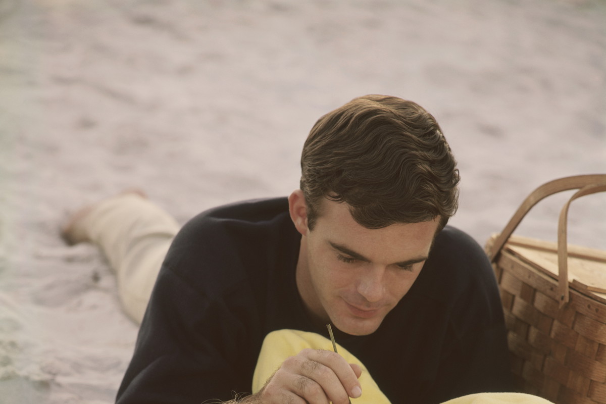 Young couple relaxing on beach picnic