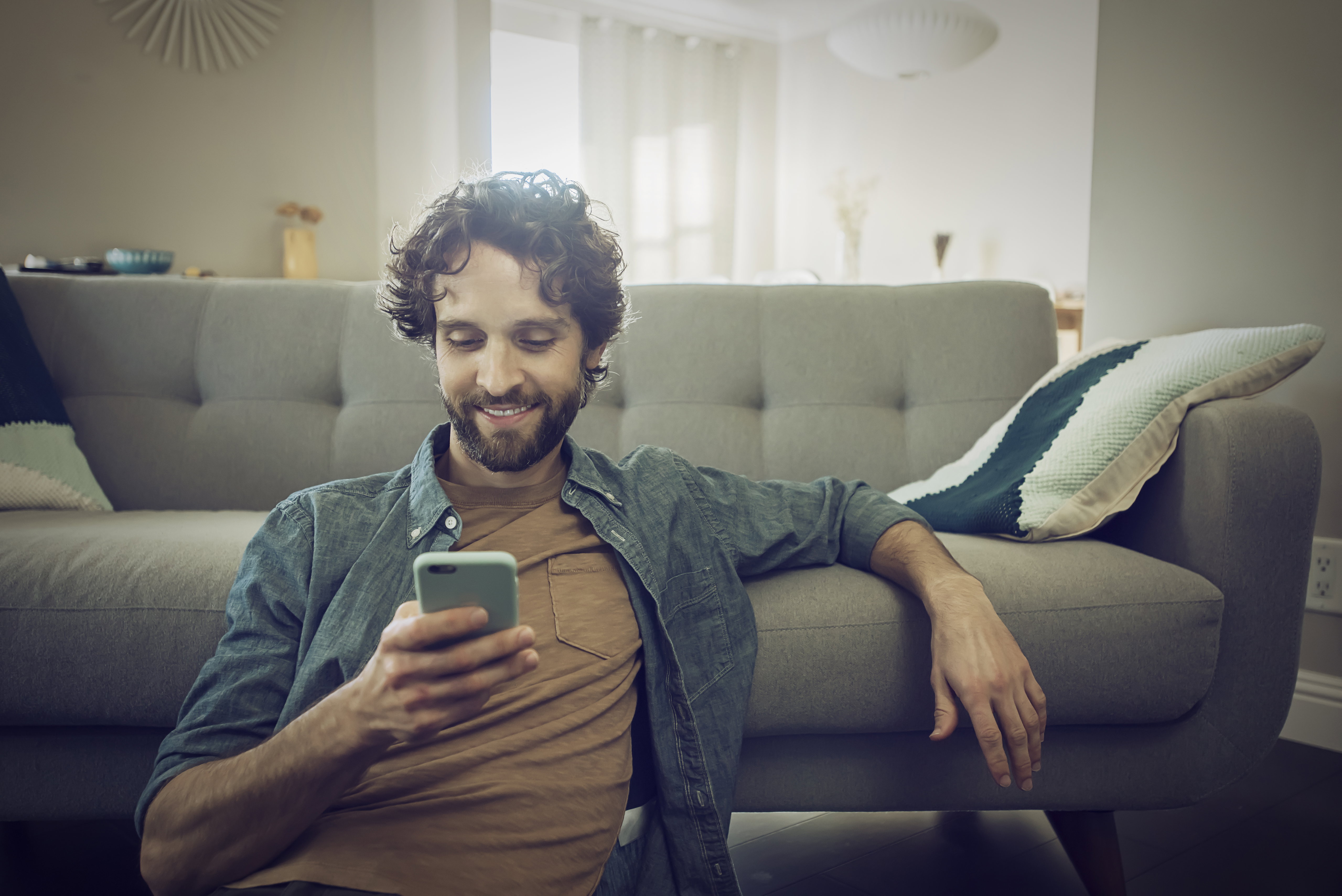 Man checks smartphone