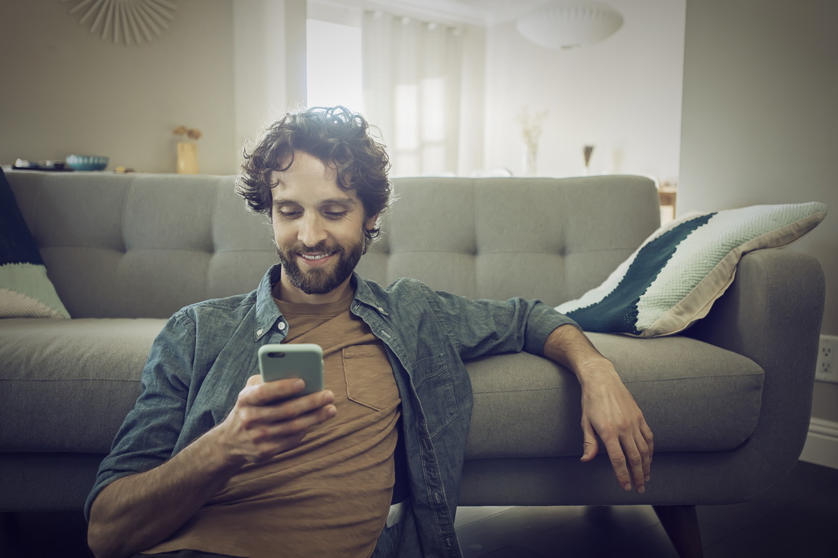 Man checks smartphone