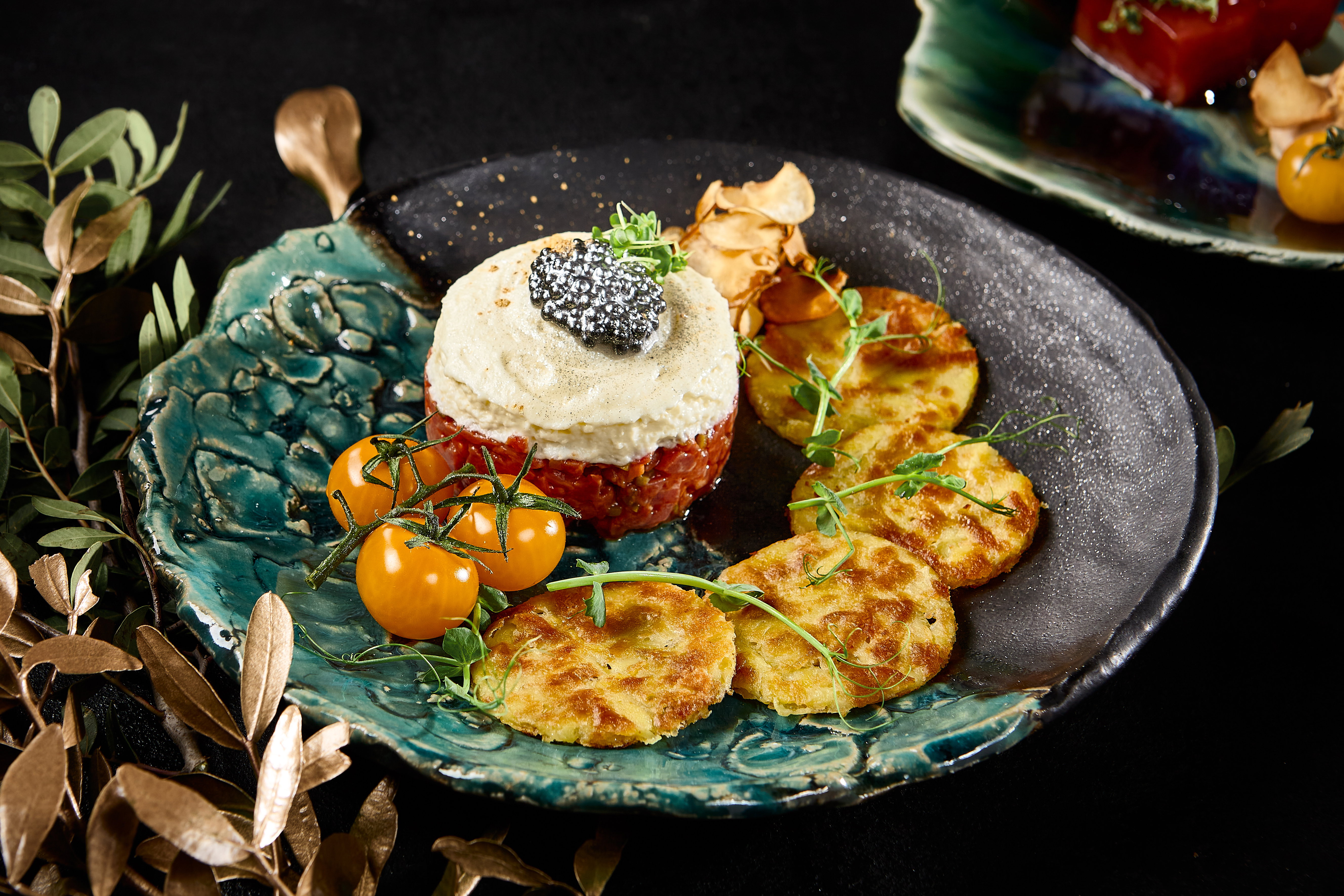 Gourmet Beef Tartare with Draniki and Caviar on Artistic Plate