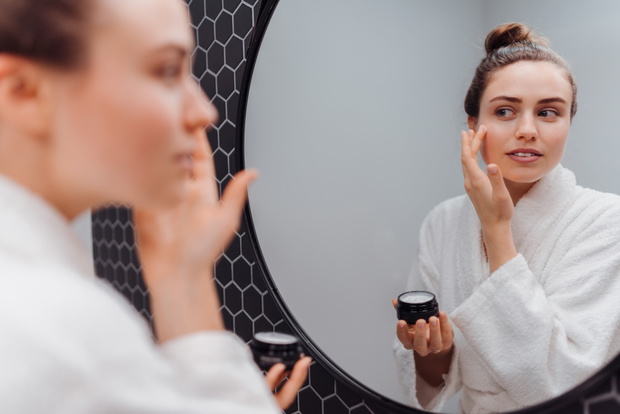 Young woman having skin routine.