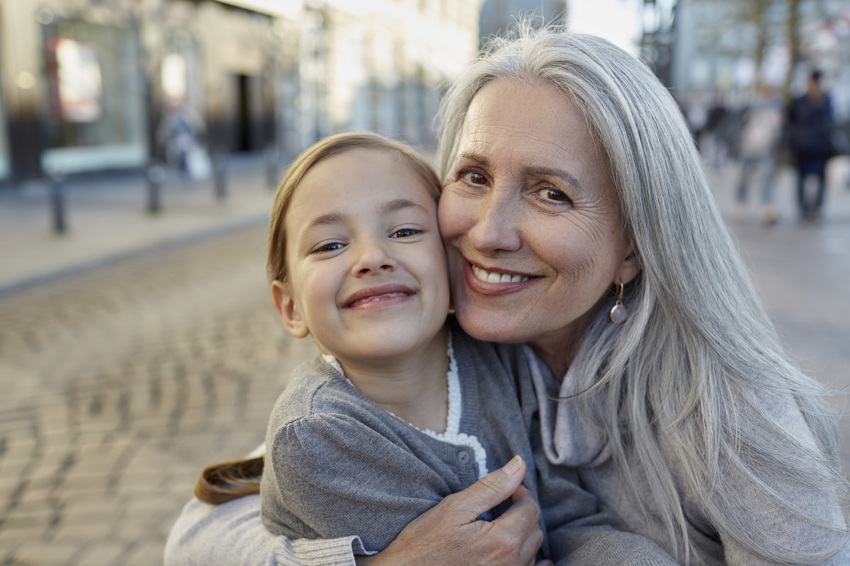 Portrait of smiling grandmother with granddaughter