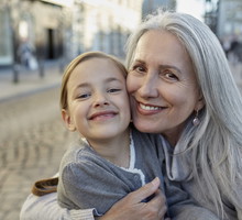 Portrait of smiling grandmother with granddaughter