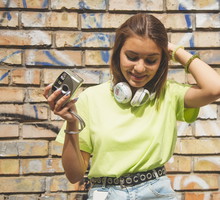 Life style portrait of beautiful modern girl with film camera