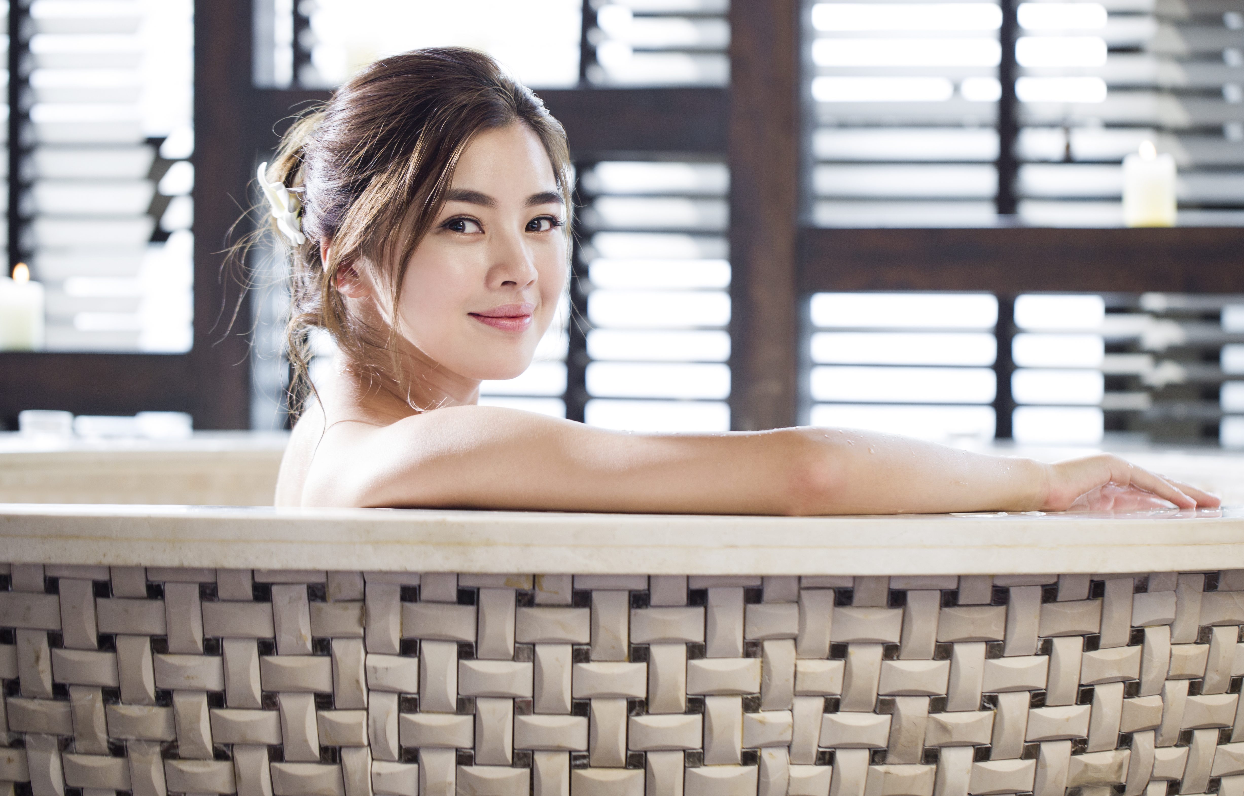 Beautiful young woman in bathtub