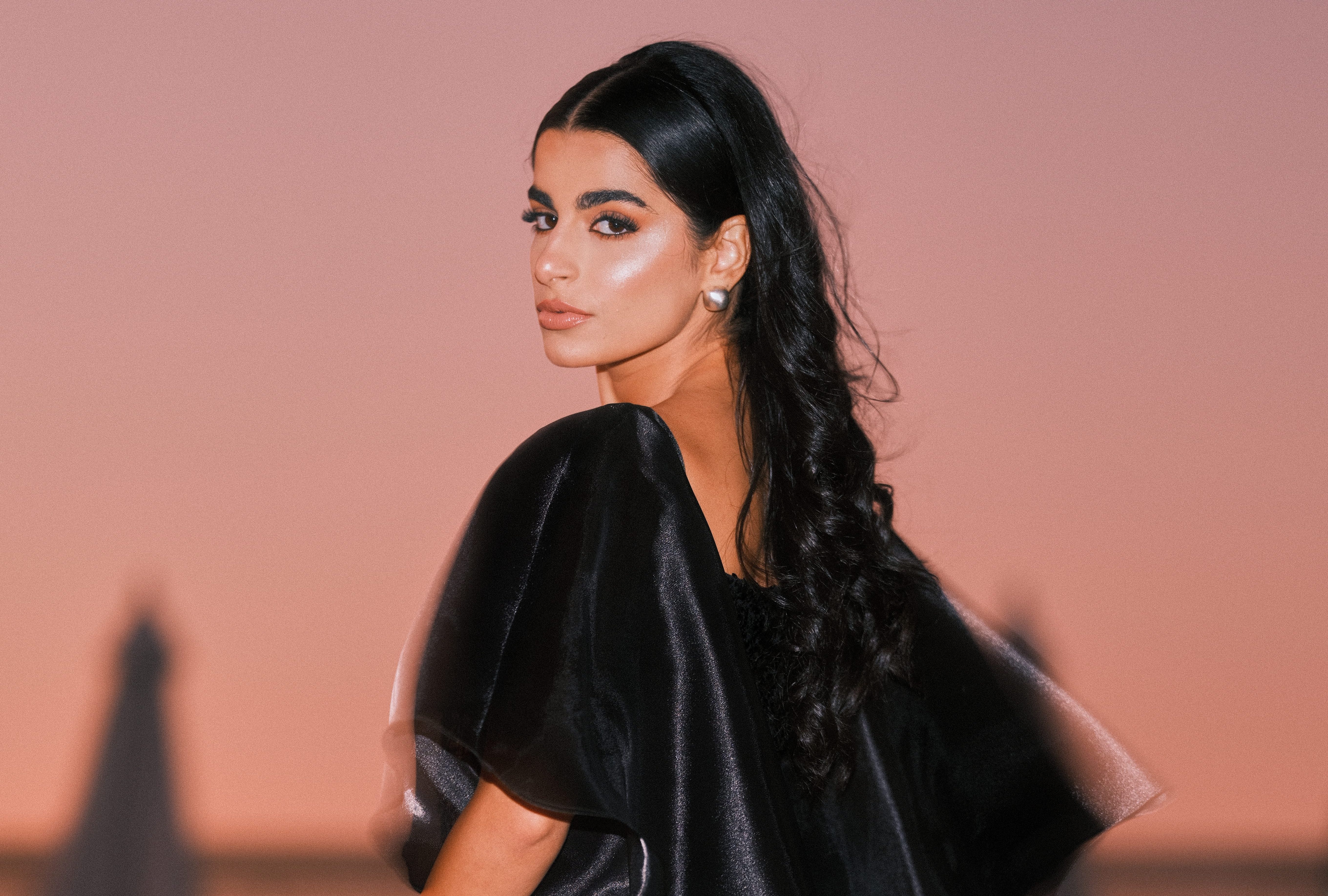 Portrait of young woman standing against sky during sunset,Egypt