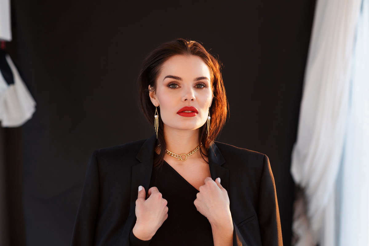 Charming stylish brunette in the sunset lights