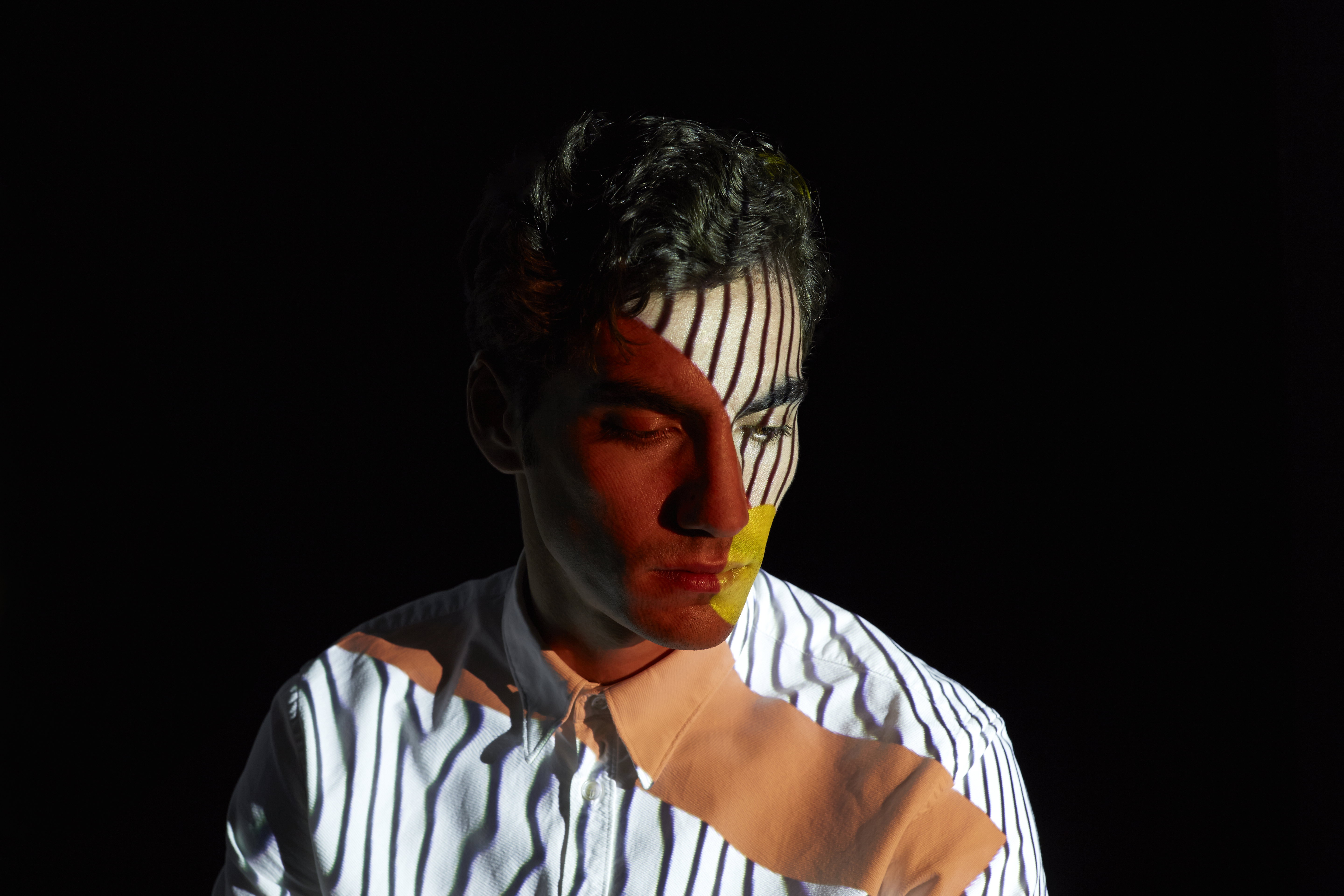 Young Man with Colorful Patterns and Lines